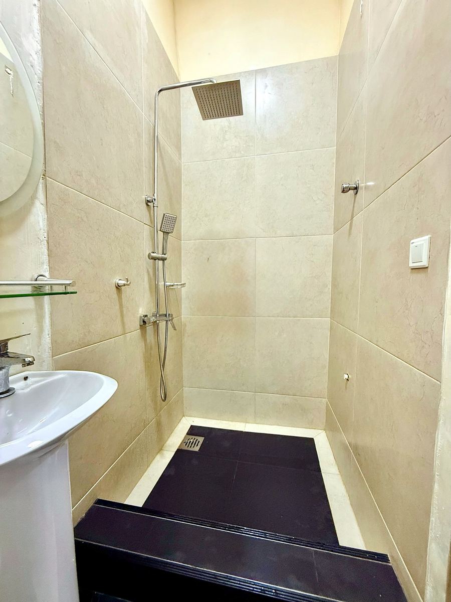 Economy studio suite, Studio suite bathroom with walk-in rainfall shower