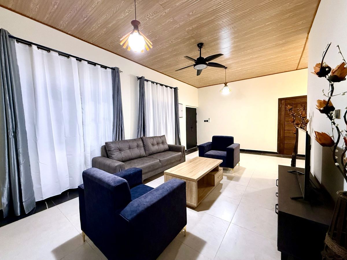 Living room with sofa and armchairs