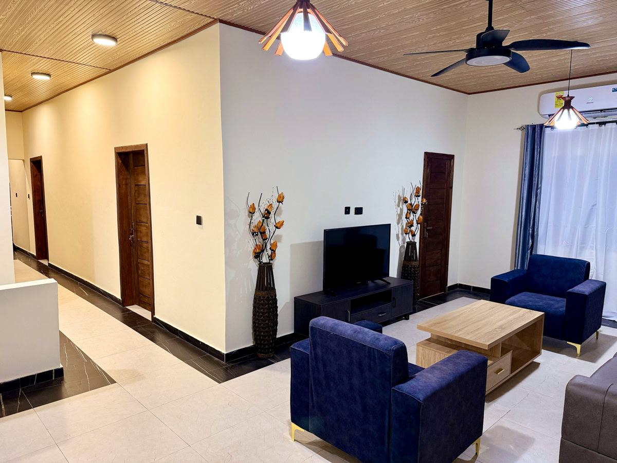 Living area with hallway and TV