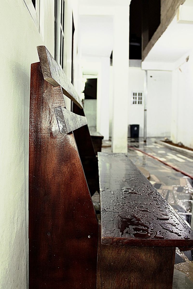 Wooden bench along the covered walkway