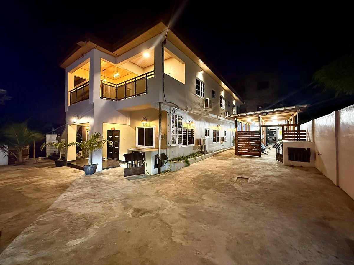 Sanga Estates building, courtyard and covered walkway at night